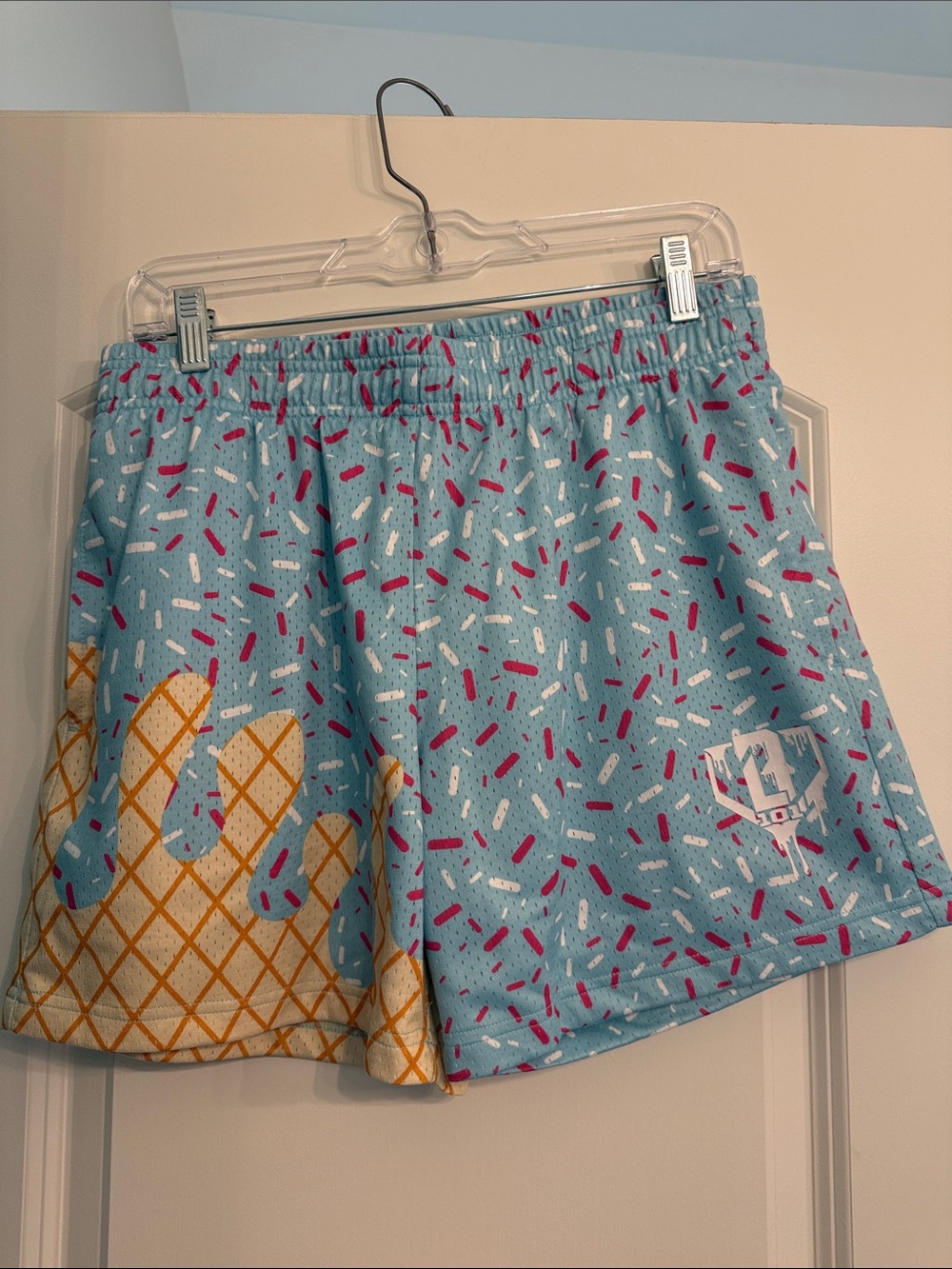 Light Blue Athletic Shorts with Pink & White Sprinkles and Gold Cone